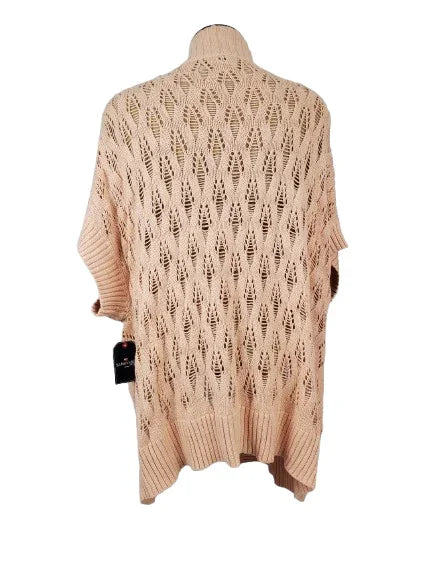 peach knitted cardigan on a mannequin against a white background