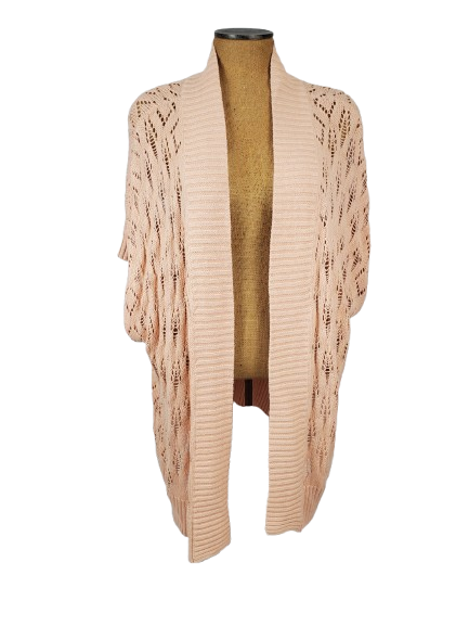 peach cardigan on a mannequin against a white background