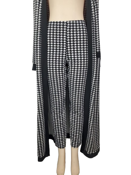 Houndstooth patterned pants on a mannequin with a black cardigan.