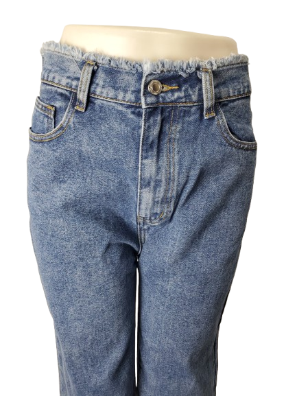 Blue jeans on a mannequin with a white background