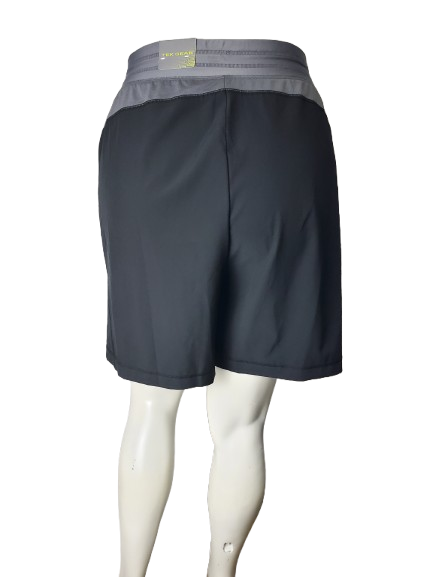 Dark gray athletic shorts with a gray waistband on a white background