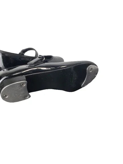 Black tap shoe on a white background