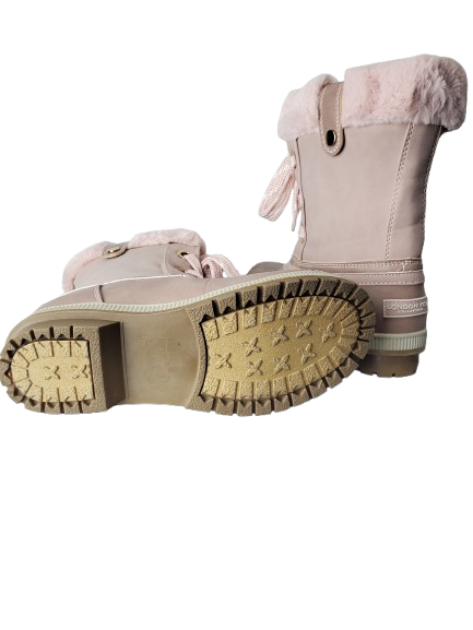 Pink winter boot with fur lining on a white background