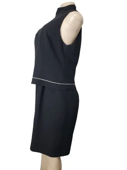 Black sleeveless top and skirt set on a mannequin against a white background