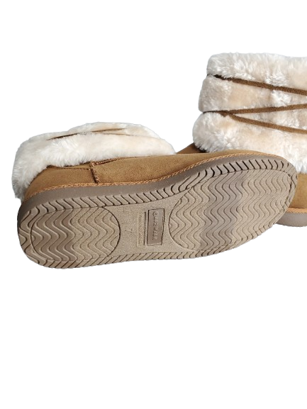 Pair of tan slippers with white fur lining on a white background