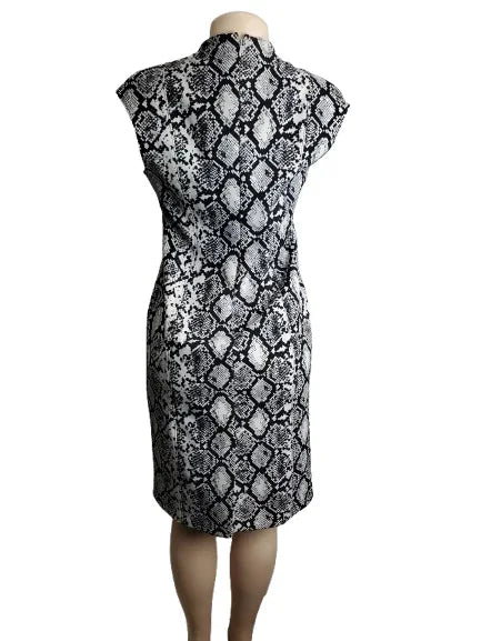 Black and white patterned dress on a mannequin against a white background