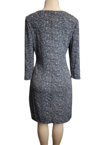 Black and white patterned dress on a mannequin against a white background