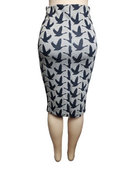 Pencil skirt with bird pattern on a mannequin against a white background