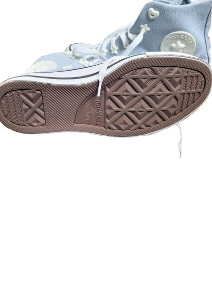 Light blue high-top sneaker with brown sole on a white background