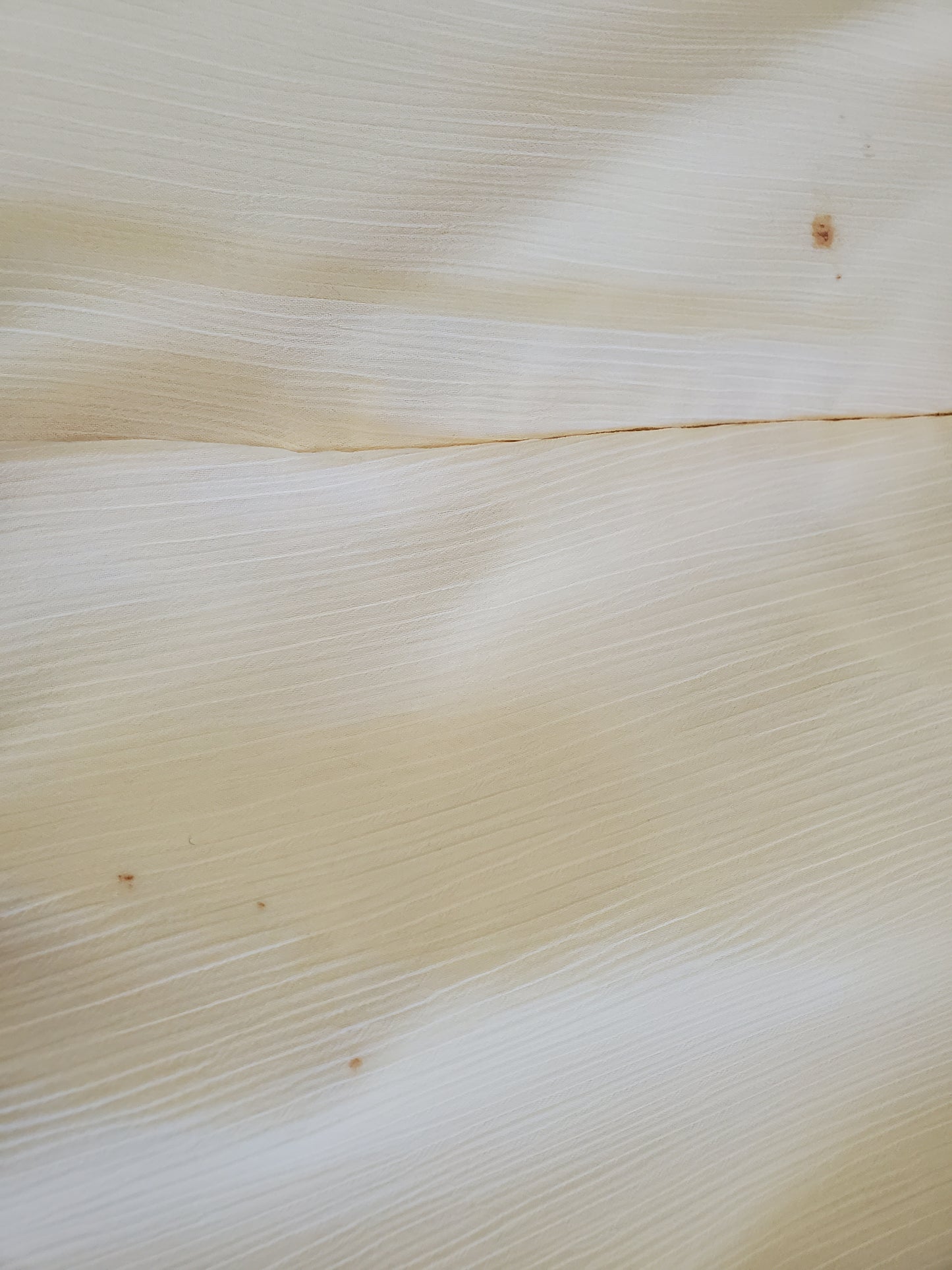 Close-up of a textured beige fabric surface