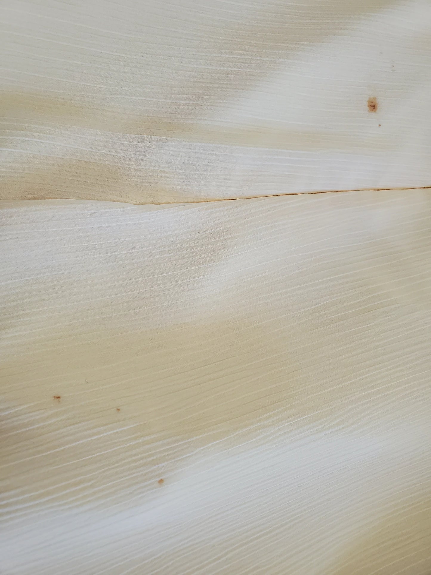 Close-up of a textured beige fabric surface
