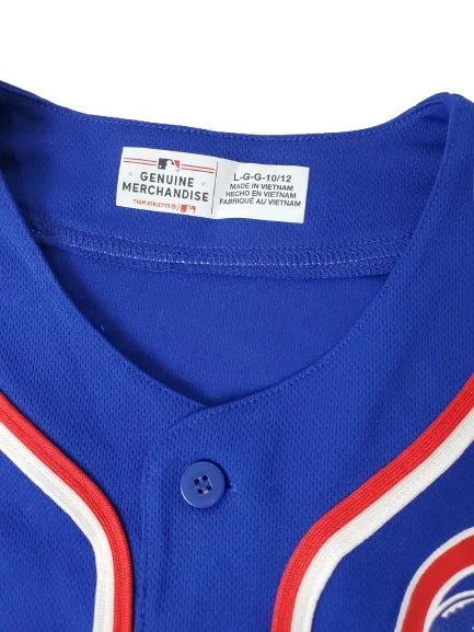 Close-up of a blue sports jersey with a brand label on a white background