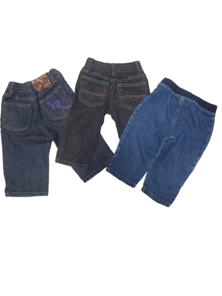 Three pairs of blue jeans stacked on a white background