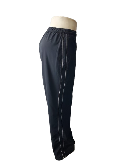 Black pants with white stripes on a mannequin against a white background