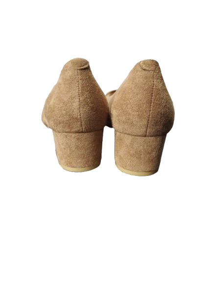 Pair of brown suede high-heeled shoes on a white background