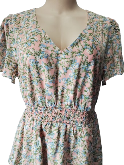 Floral dress on a mannequin with a white background