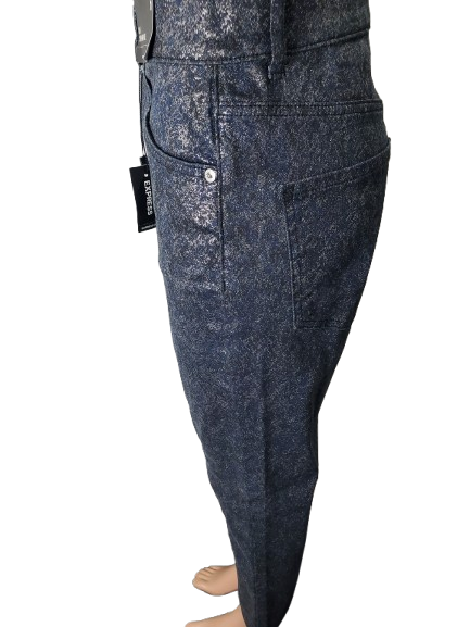 Dark blue jeans on a mannequin with a visible brand tag against a white background