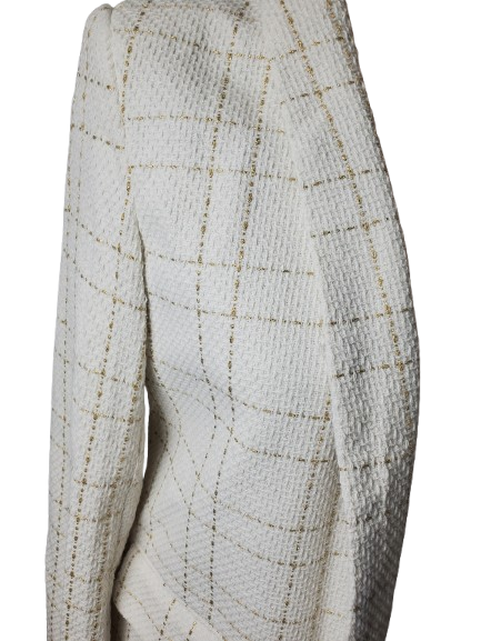 Close-up of a textured fabric with a grid pattern on a white background
