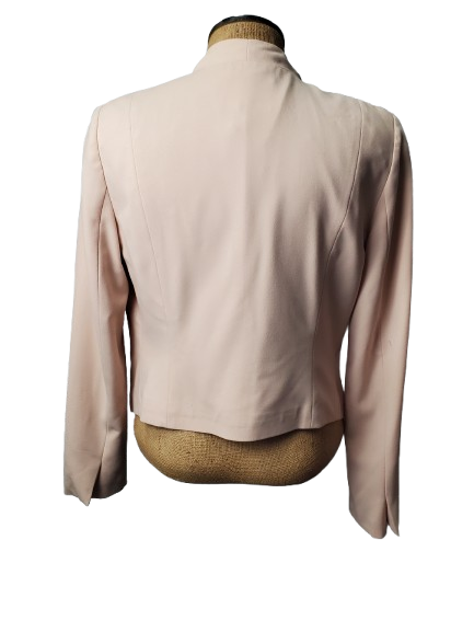 Beige blazer on a mannequin with a white background