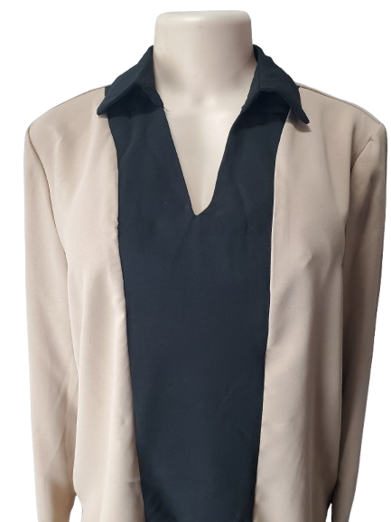 Mannequin wearing a beige cardigan over a navy shirt on a white background