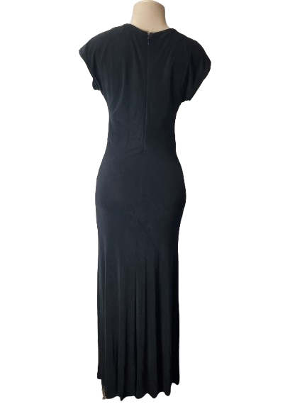 Black dress on a mannequin against a white background