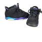 Pair of black sneakers with purple and blue accents on a white background
