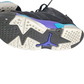 Close-up of a sneaker with a distinctive sole design on a white background