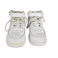 Pair of white high-top sneakers on a white background