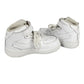 White sneakers with a Nike logo on a white background