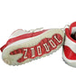 Red and white sneakers with 'Zoo York' branding on a white background