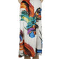 Colorful dress with abstract design on a mannequin against a white background