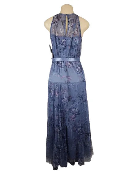 Blue floral dress on a mannequin against a white background