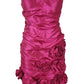 Pink strapless dress with floral details on a white background
