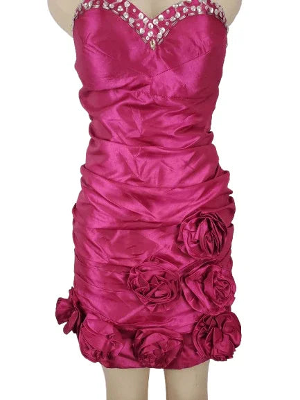Pink strapless dress with floral details on a white background