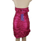 Pink strapless dress on a mannequin with a tag against a white background