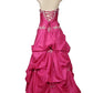 Pink gown with intricate detailing on a mannequin against a white background
