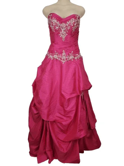 Pink strapless gown with silver embroidery on a white background