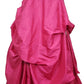 Pink gown with floral embellishments on a white background