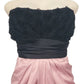 Black strapless dress with floral details on a mannequin against a white background