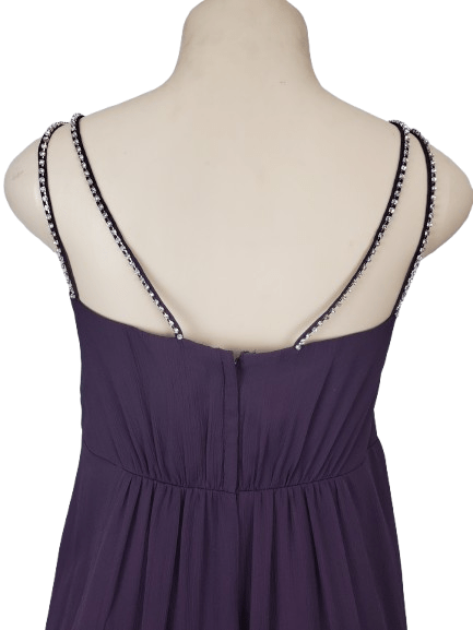 Purple dress with thin straps on a mannequin against a white background