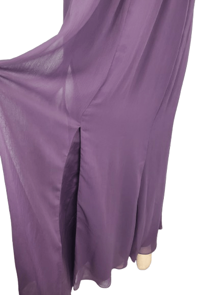 Purple fabric draped over a mannequin on a white background