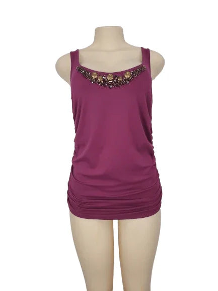 Purple tank top with embellishments on a mannequin against a white background