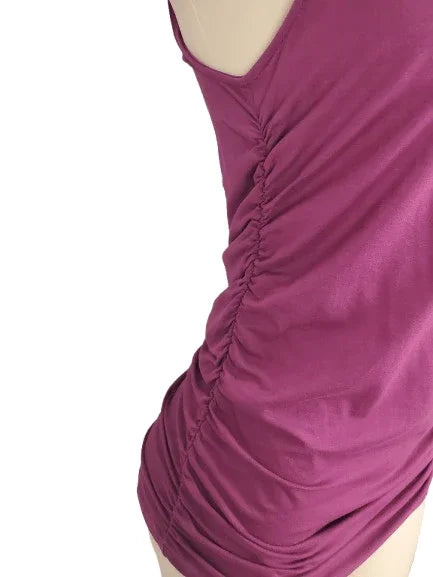 Purple tank top on a mannequin against a white background