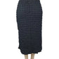 Black textured skirt on a mannequin against a white background
