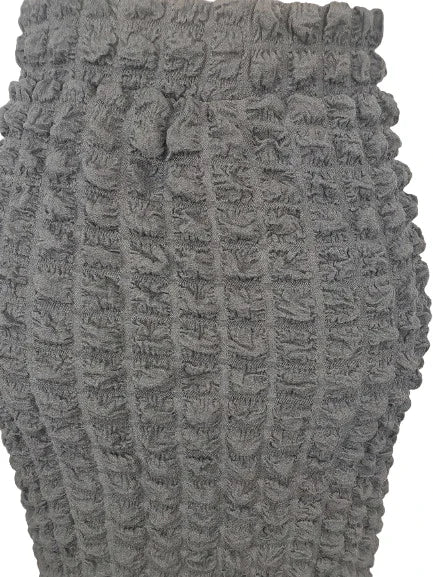 Close-up of a textured gray fabric with a waffle pattern