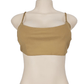 Beige tank top on a mannequin against a white background