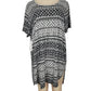 Black and white patterned dress on a mannequin against a white background
