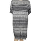 Black and white patterned dress on a mannequin against a white background