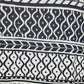 Black and white patterned fabric with various designs