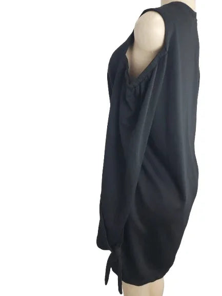 Black sleeveless top on a mannequin against a white background